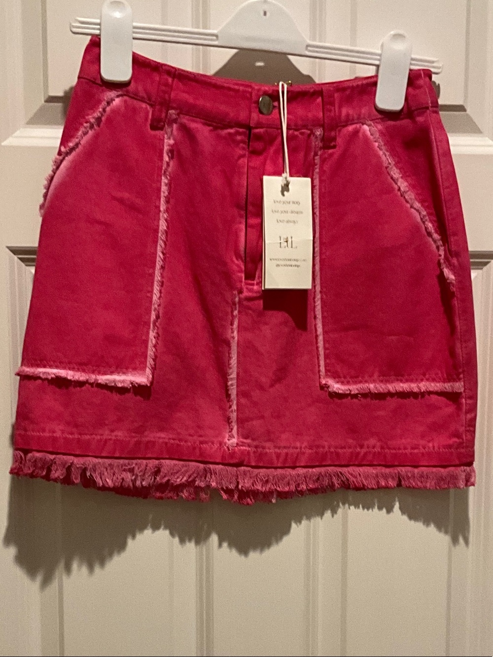 Love the Label-Frayed Pocket Mini Skirt in Bright Pink